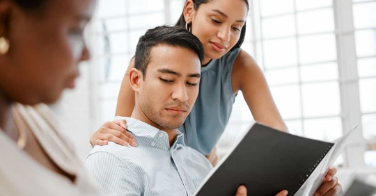 woman touching man on the shoulder