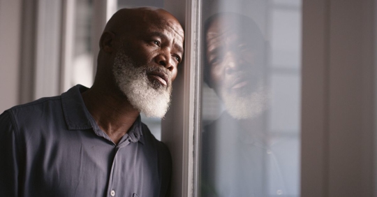 Older male employee looking defeated