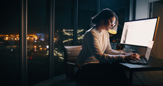 woman working in an office at night