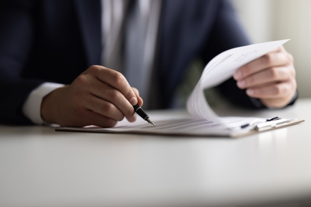 person signing a contract